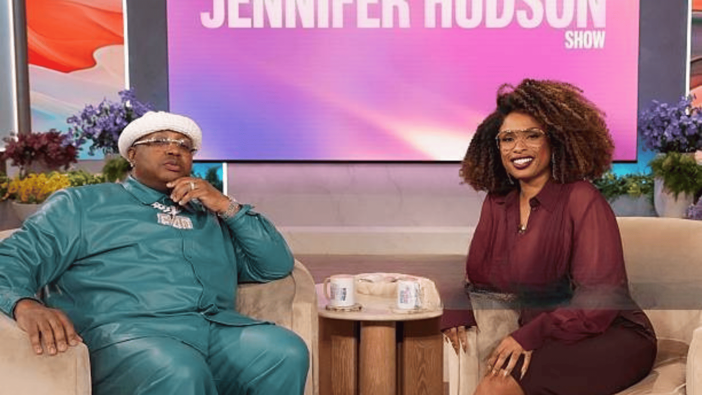 The Jennifer Hudson Show star E-40 joins Jennifer Hudson in stylish teal leather and burgundy monochrome looks during the February 25, 2026 episode.