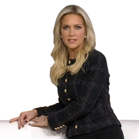 Fox and Friends star Ainsley Earhardt wears a stylish plaid jacket, adding a pop of elegance to the studio set.