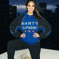 Misty Copeland Marty Supreme hooded jacket in navy and black with white piping, MARTY SUPREME text on the front and Made in America graphic on the back.