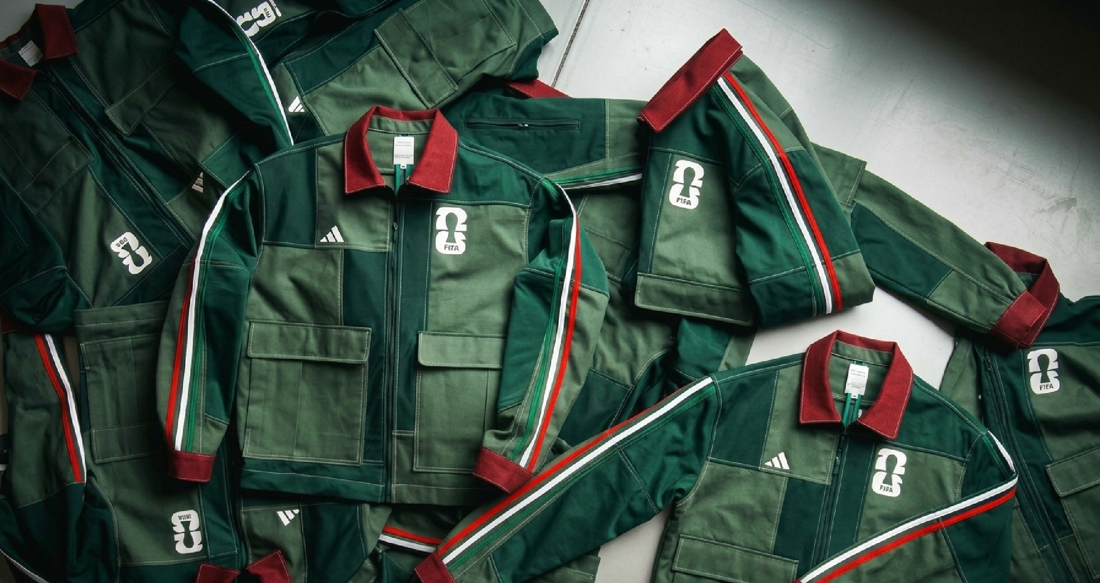 Mexico 2026 Adidas National Team green worker jacket with burgundy collar, tricolor sleeve stripes, cargo pockets, and team crest