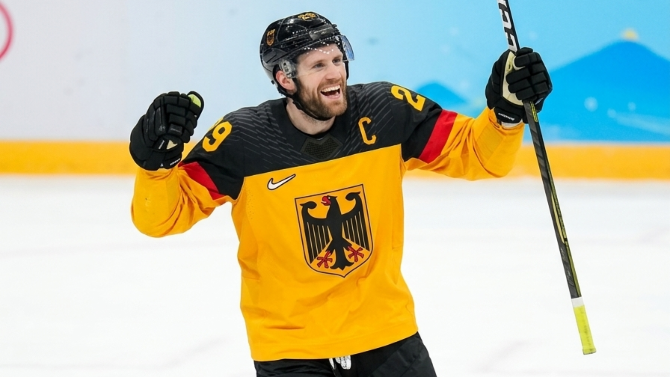 Leon Draisaitl 2026 Winter Olympics Team Germany yellow and black ice hockey jersey with Bundesadler crest