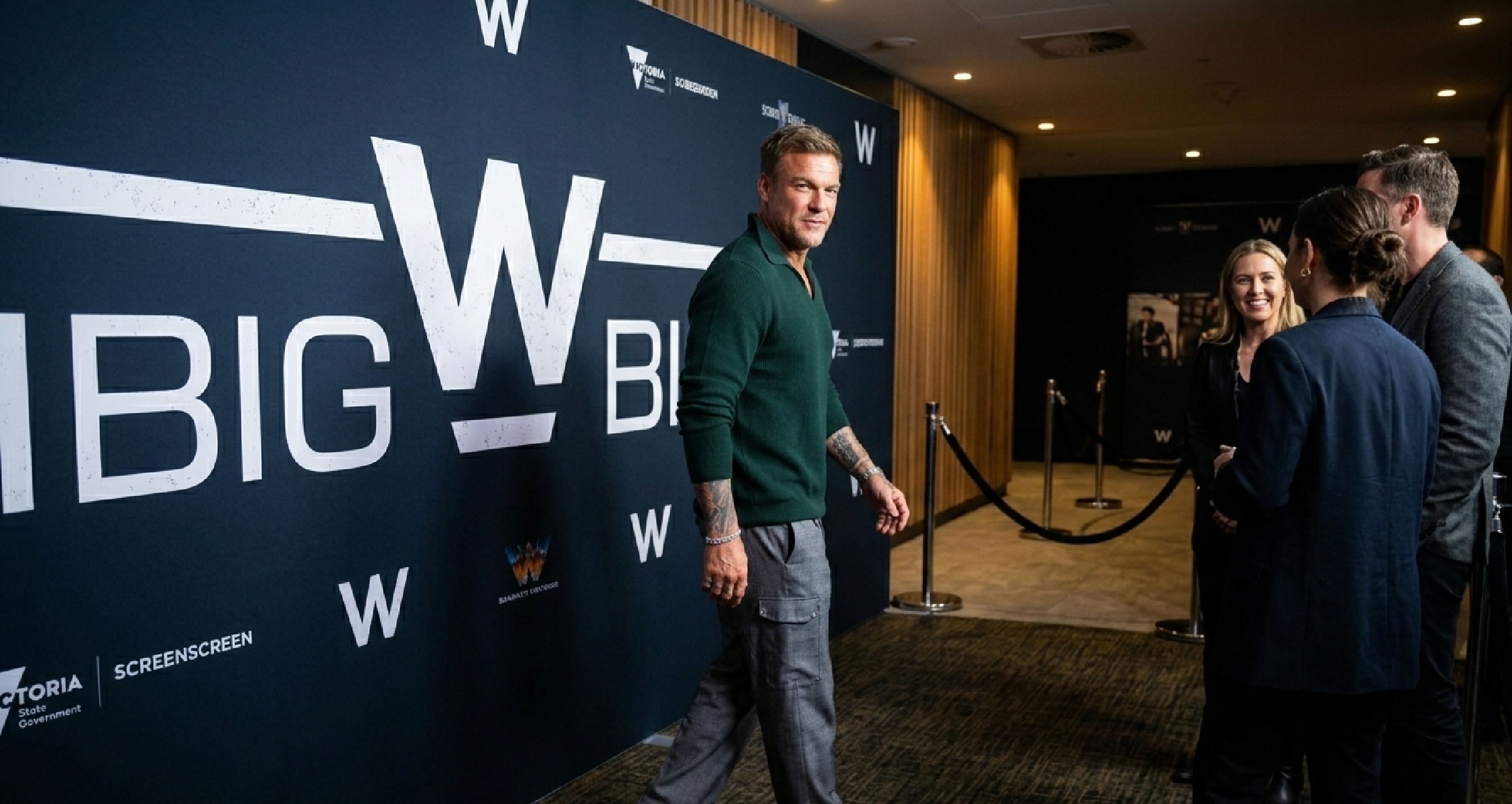 Alan Ritchson War Machine Australian Premiere 2026 deep green pullover sweatshirt with fine micro rib texture