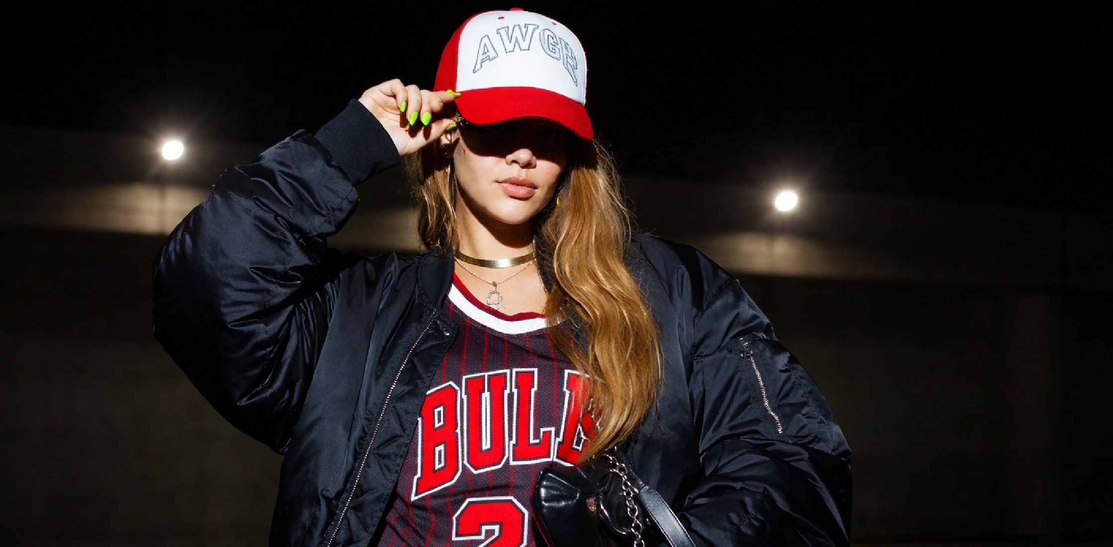 Rihanna wearing F1 Race Las Vegas oversized black satin bomber jacket with utility pockets