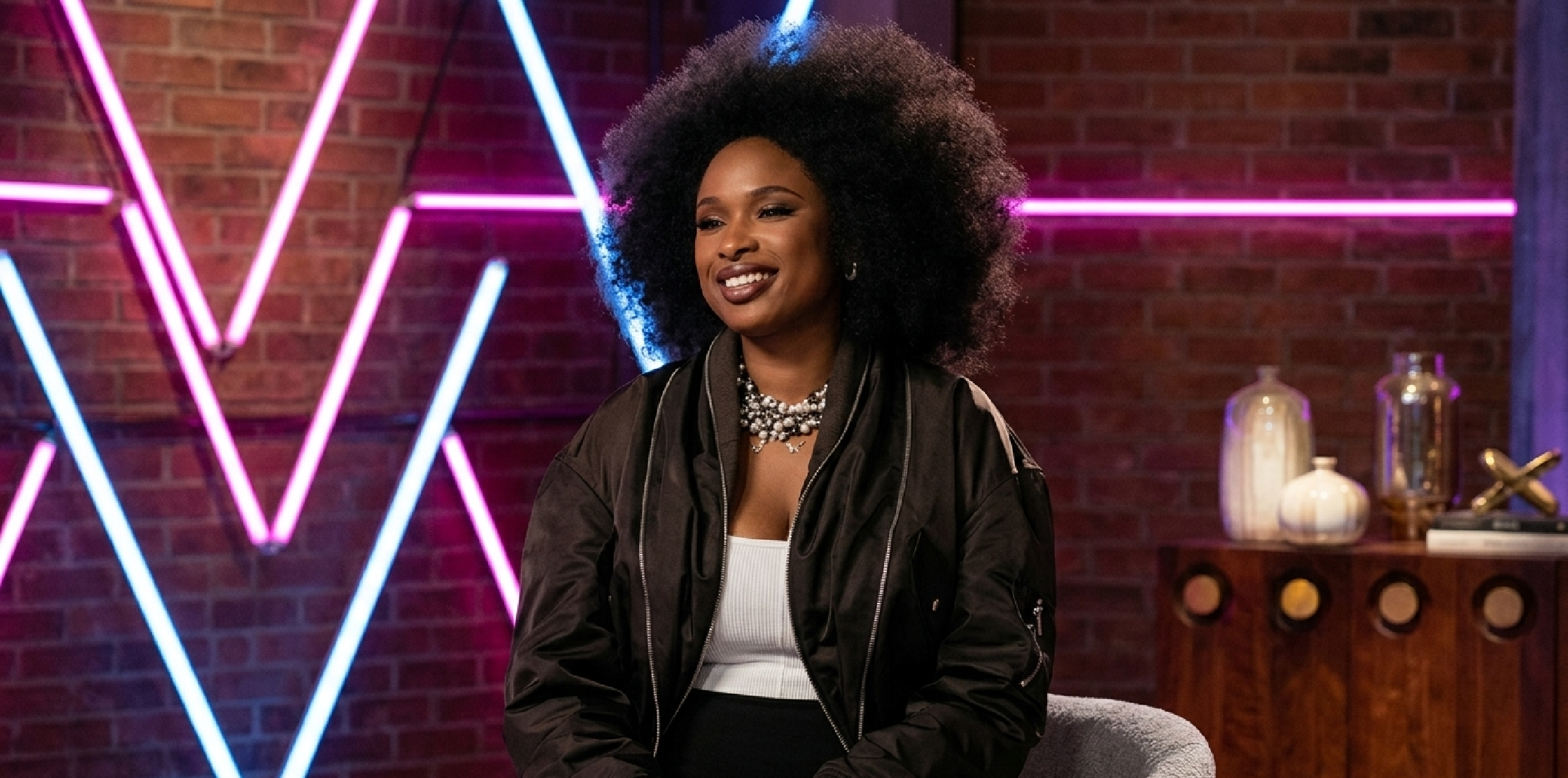 The Voice S29 Jennifer Hudson black oversized bomber jacket with silver zipper detailing and dropped shoulders