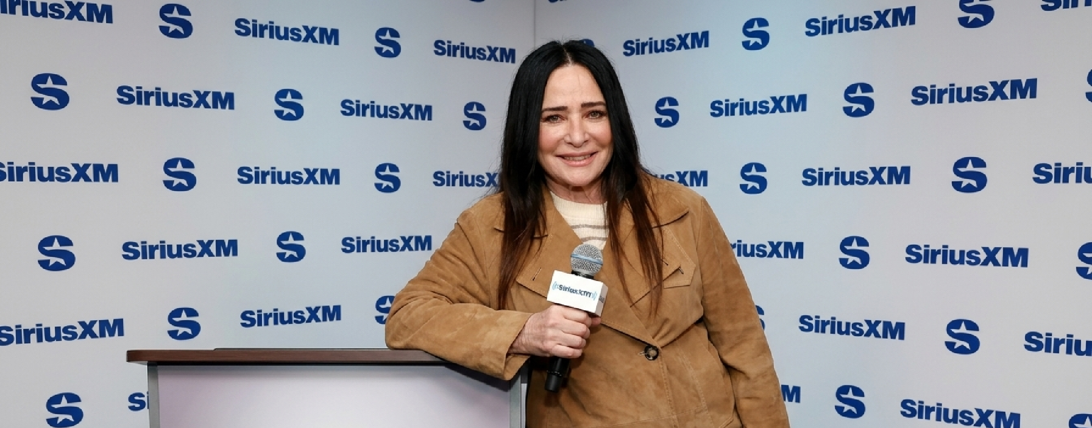 Pamela Adlon inspired brown suede double-breasted jacket at SiriusXM Studios 2025