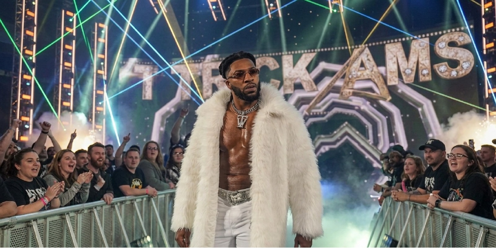 Trick Williams WWE SmackDown 2026 white oversized longline faux fur coat with wide lapels