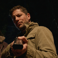 Round The Decay 2025 Damian Maffei olive green stand-collar rugged utility jacket with multiple pockets and military-inspired design