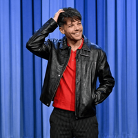 Louis Tomlinson S13 black leather oversized biker jacket with silver buckle and grommet collar