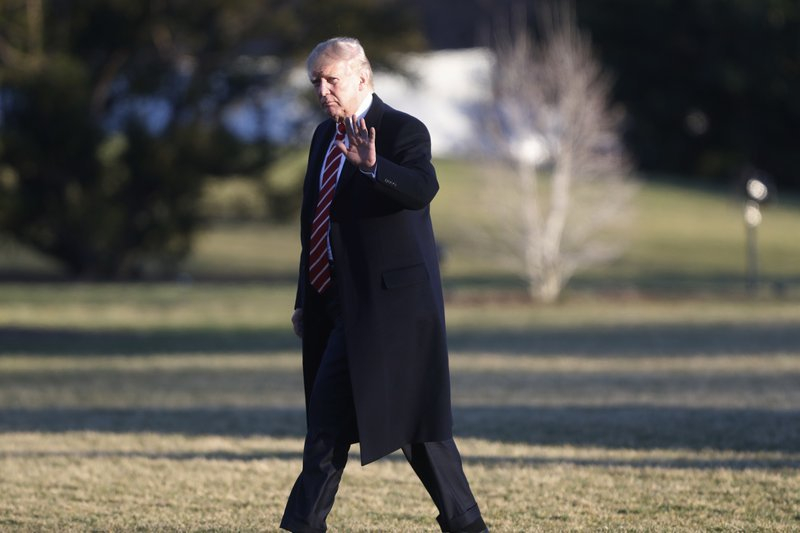 Donald Trump wearing black wool Chesterfield overcoat with padded shoulders and notched lapels