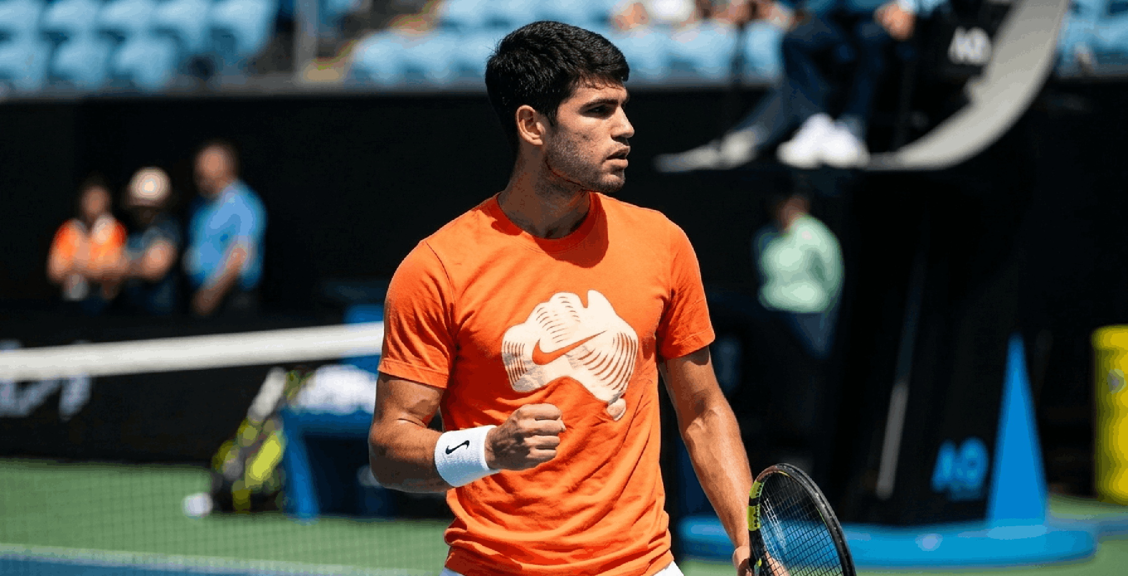 Carlos Alcaraz 2026 Australian Open T-Shirt in bright orange with cream Australian continent graphic and sporty athletic fit design