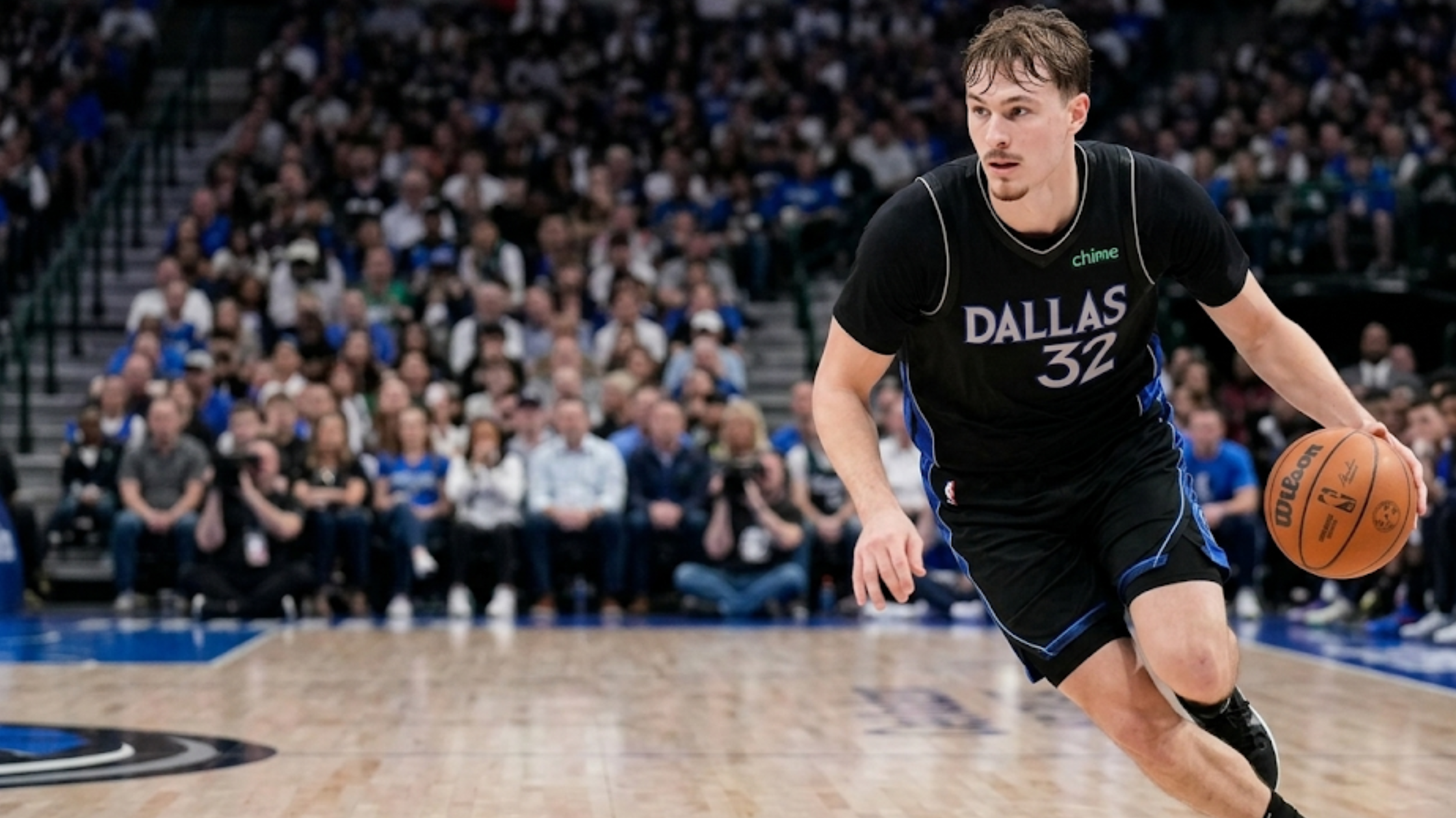 Cooper Flagg Dallas Mavericks black NBA Swingman jersey with #32, Maverick blue wing panels and silver wordmark design