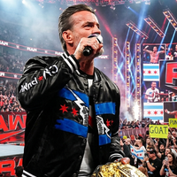 CM Punk Chicago Made Bomber Jacket in black satin polyester with Chicago flag-inspired red, white, blue accents, lightning bolt graphic, varsity ribbed cuffs, and bold back “Best in World” CM Punk design.