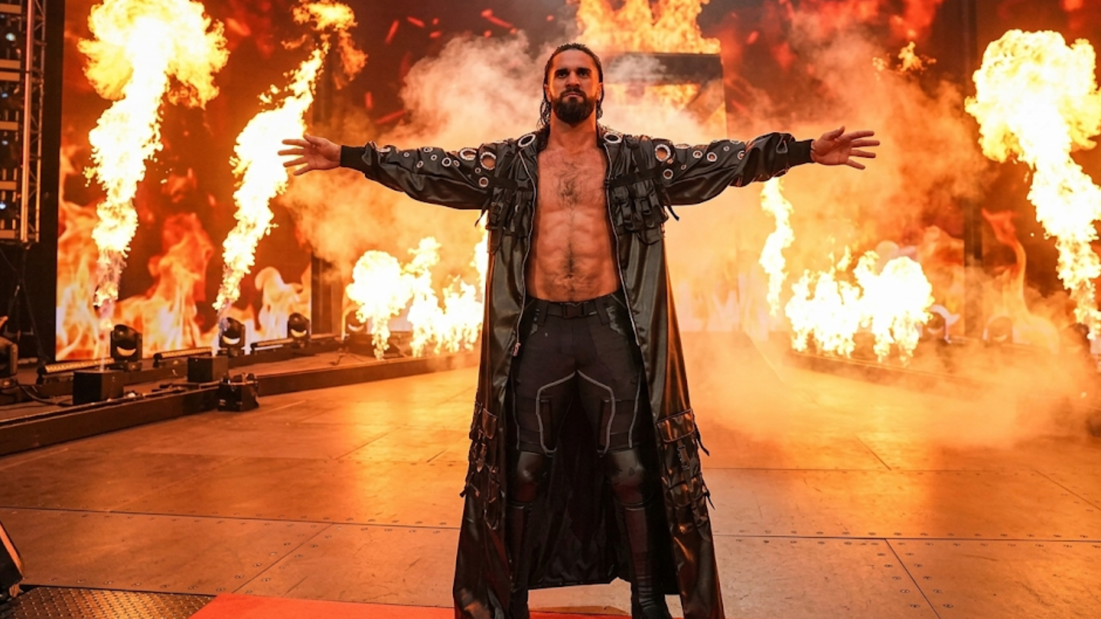 Seth Rollins WrestleMania 42 black leather longline trench coat with tactical cargo pockets and oversized silver grommet detailing