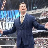 John Cena WrestleMania 42 navy pinstripe blazer with three-piece tailored suit worn during hosting in Las Vegas 2026.