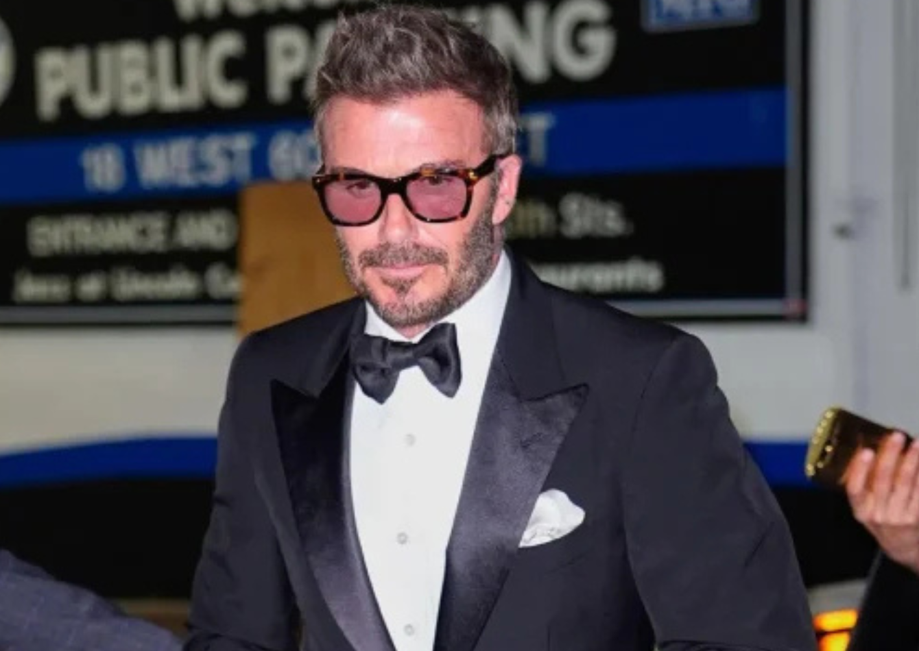 David Beckham wearing a black tuxedo with satin peak lapels, bow tie, and patent leather shoes at the Time 100 Gala 2026 in New York