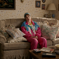 Opalite Taylor Swift pink vintage tracksuit featuring neon pink, white, and cerulean blue color-block windbreaker with retro 90s streetwear style.