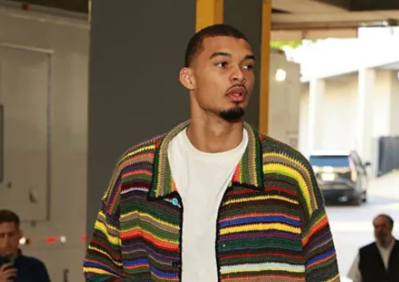 Victor Wembanyama wearing a multicolor oversized striped wool cardigan jacket arriving at Moda Center Arena for Spurs vs Trail Blazers 2026 NBA Playoffs