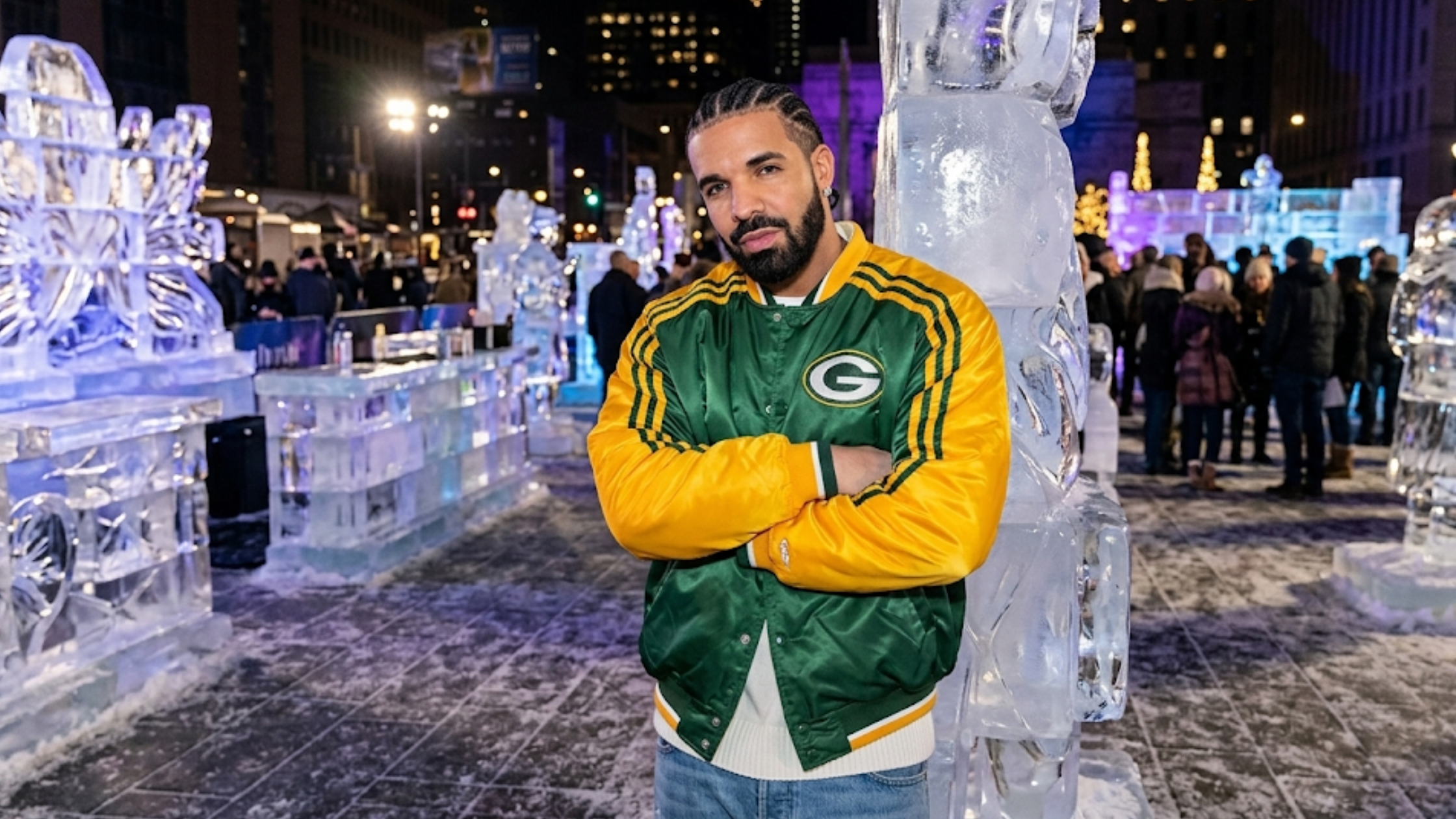 Drake Green Bay Packers green satin bomber jacket with gold raglan sleeves, striped ribbed trim, and embroidered logo detailing