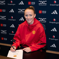 Lea Schuller Manchester United Women cherry red hoodie with embroidered club crest, Adidas 3-Bar logo, full-zip design, and oversized modern streetwear fit.