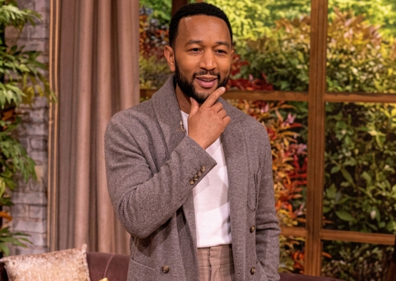 John Legend wearing a shawl collar cardigan on The View April 27, 2026 with a relaxed elegant style