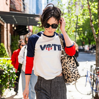Gracie Abrams Tribeca New York City 2026 T-shirt featuring off-white base, navy and red raglan sleeves, and bold VOTE graphic design in streetwear style