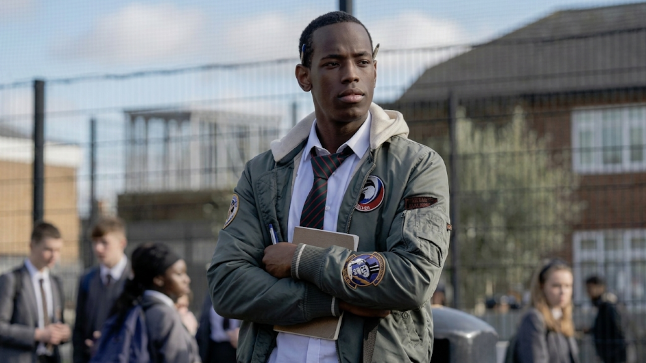 Blue Story Marco slate grey MA-1 bomber jacket with cream hood, military patch embroidery, and streetwear cinematic design