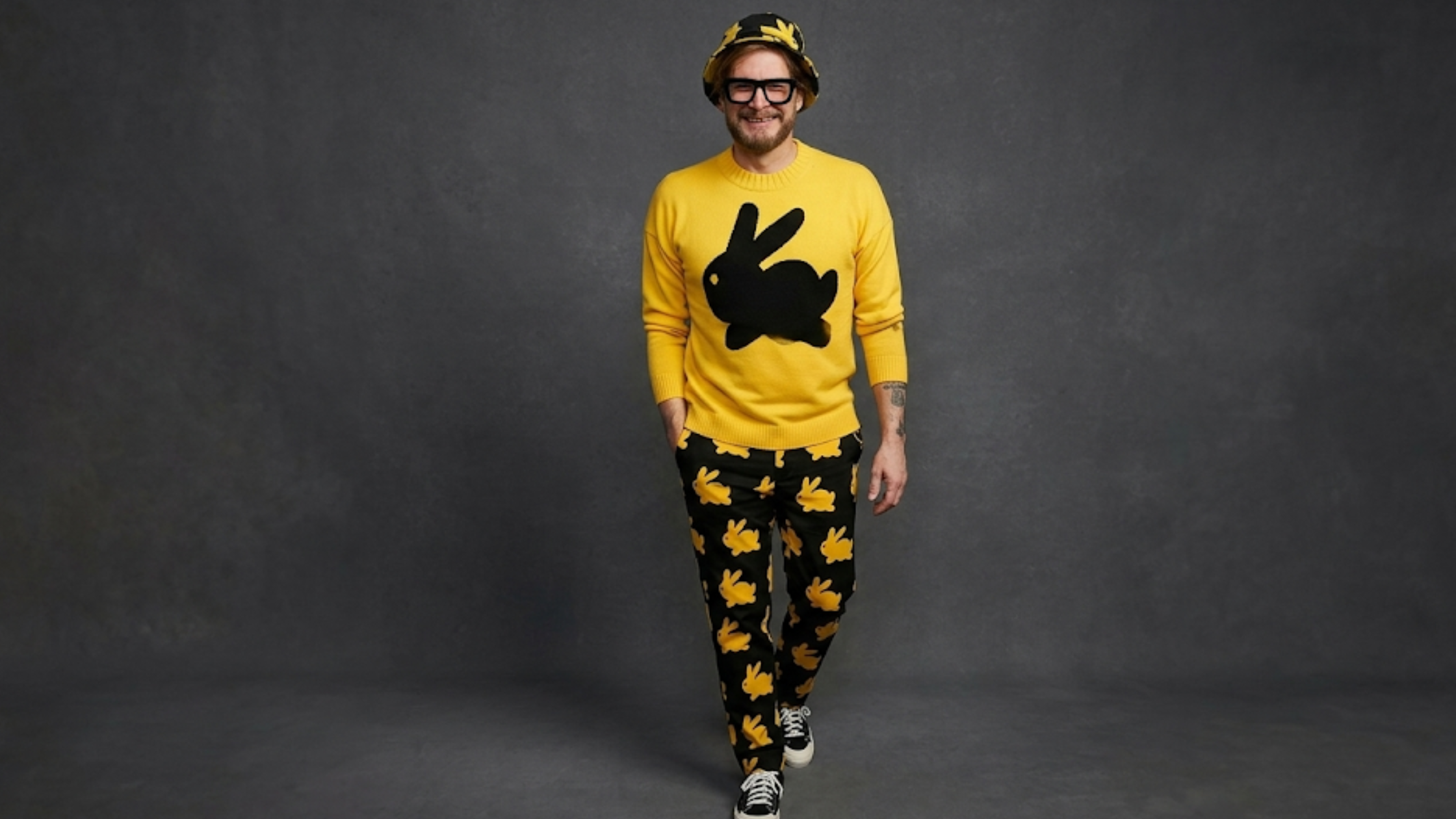 Bryan Fuller Dust Bunny yellow unisex sweatshirt with black rabbit silhouette graphic and cinematic spray-painted design