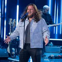 Chris Tungseth wearing American Idol S23 dusty ice-blue suede trucker jacket with asymmetrical pockets and cropped silhouette in Episode 12 streetwear look