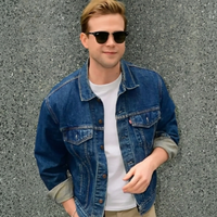 Leo Woodall NYC 2026 denim jacket styled in an effortless streetwear look featuring a medium-dark blue wash, relaxed fit, and urban New York backdrop.