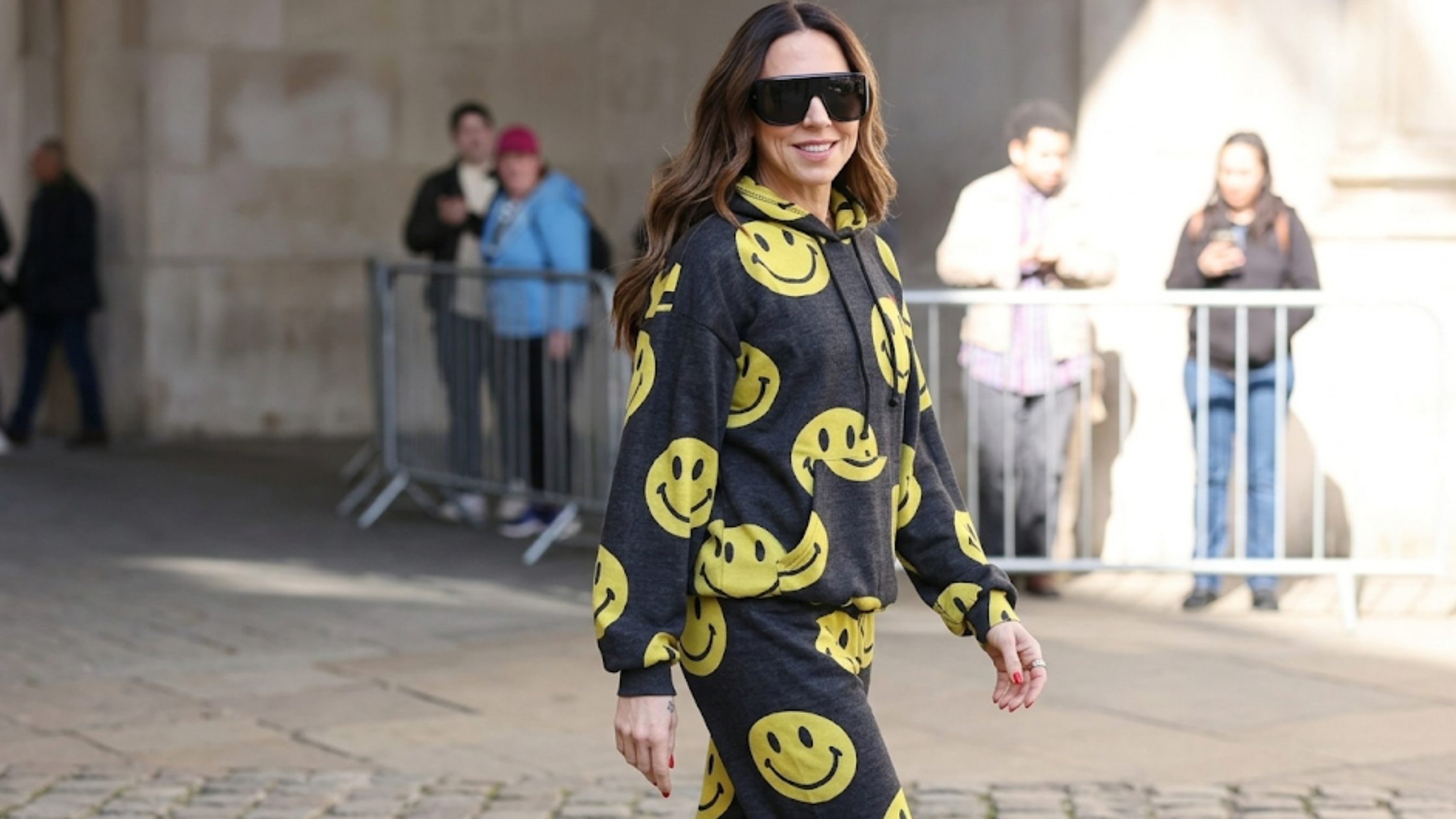 Melanie C BBC Radio 2 London May 2026 charcoal grey oversized fleece hoodie with smiley face print and kangaroo pocket