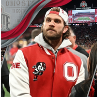 Bryce Harper wearing an Ohio State University red varsity jacket with white leather sleeves and embroidered Buckeyes patches