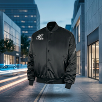 Jackie Robinson satin varsity bomber jacket in black with white embroidered detailing, featuring a classic bomber silhouette, ribbed cuffs and collar, and a sleek satin finish inspired by modern streetwear and sports heritage.