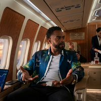Method Man wearing the Shadow Force 2025 blue printed shirt featuring tropical palm leaf graphics, white bird silhouettes, and a relaxed island-inspired streetwear design with long sleeves and a button-front style.