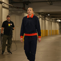 Paige Bueckers Dallas Wings vs Indiana Fever varsity sweatshirt with navy fleece body, orange collar accents, quarter-zip design, and collegiate streetwear styling.