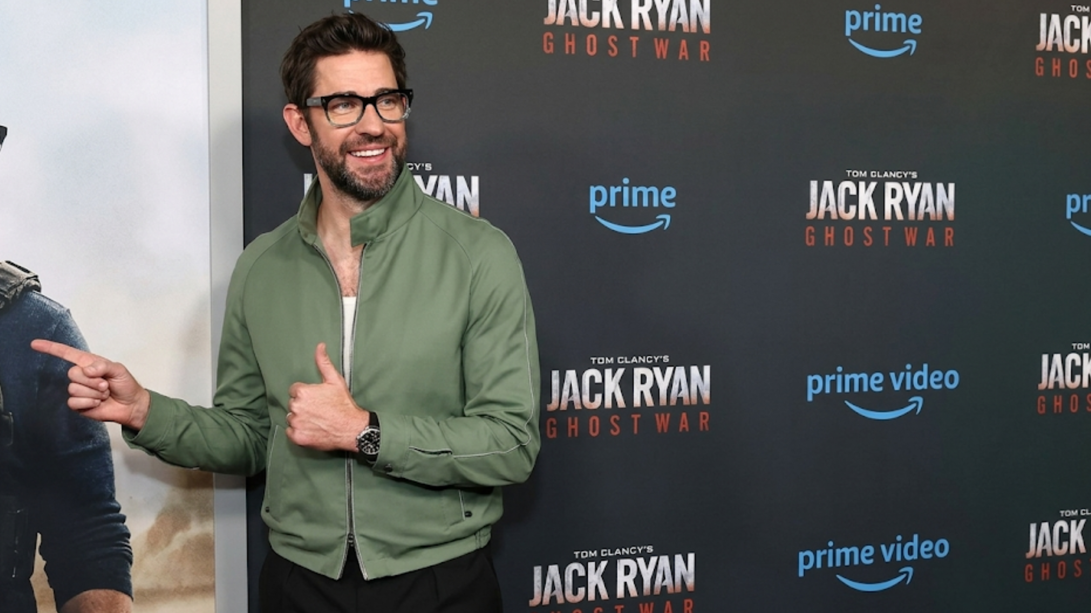 John Krasinski Jack Ryan Ghost War world premiere sage green Harrington jacket with dual zip closure red carpet celebrity outfit
