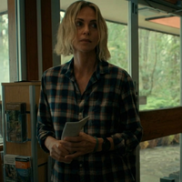 Charlize Theron Apex 2026 blue and cream plaid flannel shirt