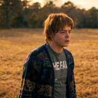 Stranger Things Season 5 Jonathan Byers retro triangle chevron cardigan with geometric V-neck design and button front knitwear