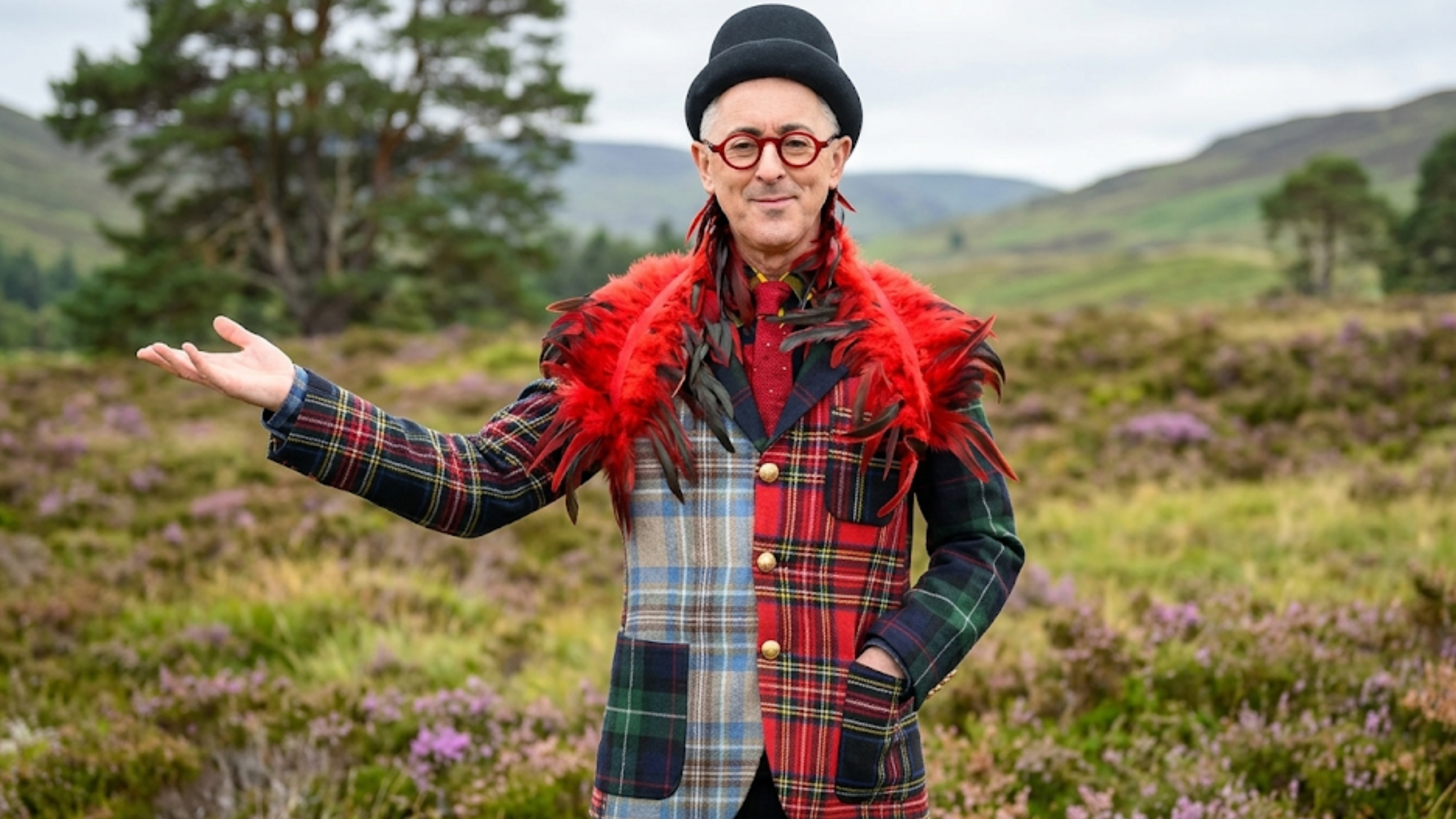 Alan Cumming The Traitors US S04 mixed tartan plaid blazer multicolor patchwork statement blazer red feather detail theatrical fashion outfit
