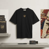 Arsenal Champions 25/26 black T-shirt with gold crest streetwear styling for match-day fashion look