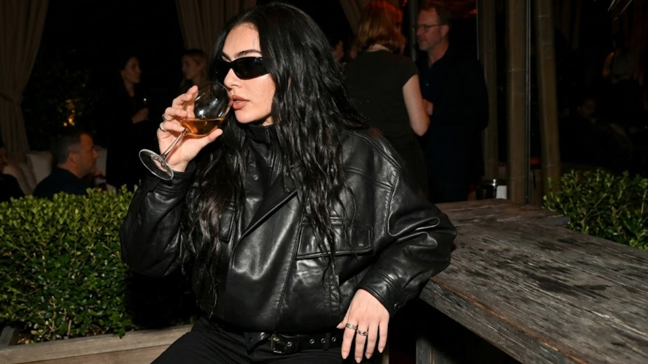 Charli XCX Marty Supreme Los Angeles Premiere oversized black leather bomber jacket with high neck collar and streetwear styling