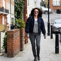 Kristin Davis Los Angeles 2026 navy blue cropped quilted puffer jacket with red Polo Ralph Lauren logo