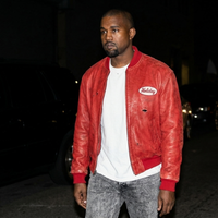 Kanye West red leather bomber jacket with retro “Holiday” chest patch and vintage streetwear style