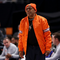 Spike Lee New York Knicks varsity satin bomber jacket in orange with tri-color sleeve stripes and 3D chest wordmark inspired by courtside basketball fashion