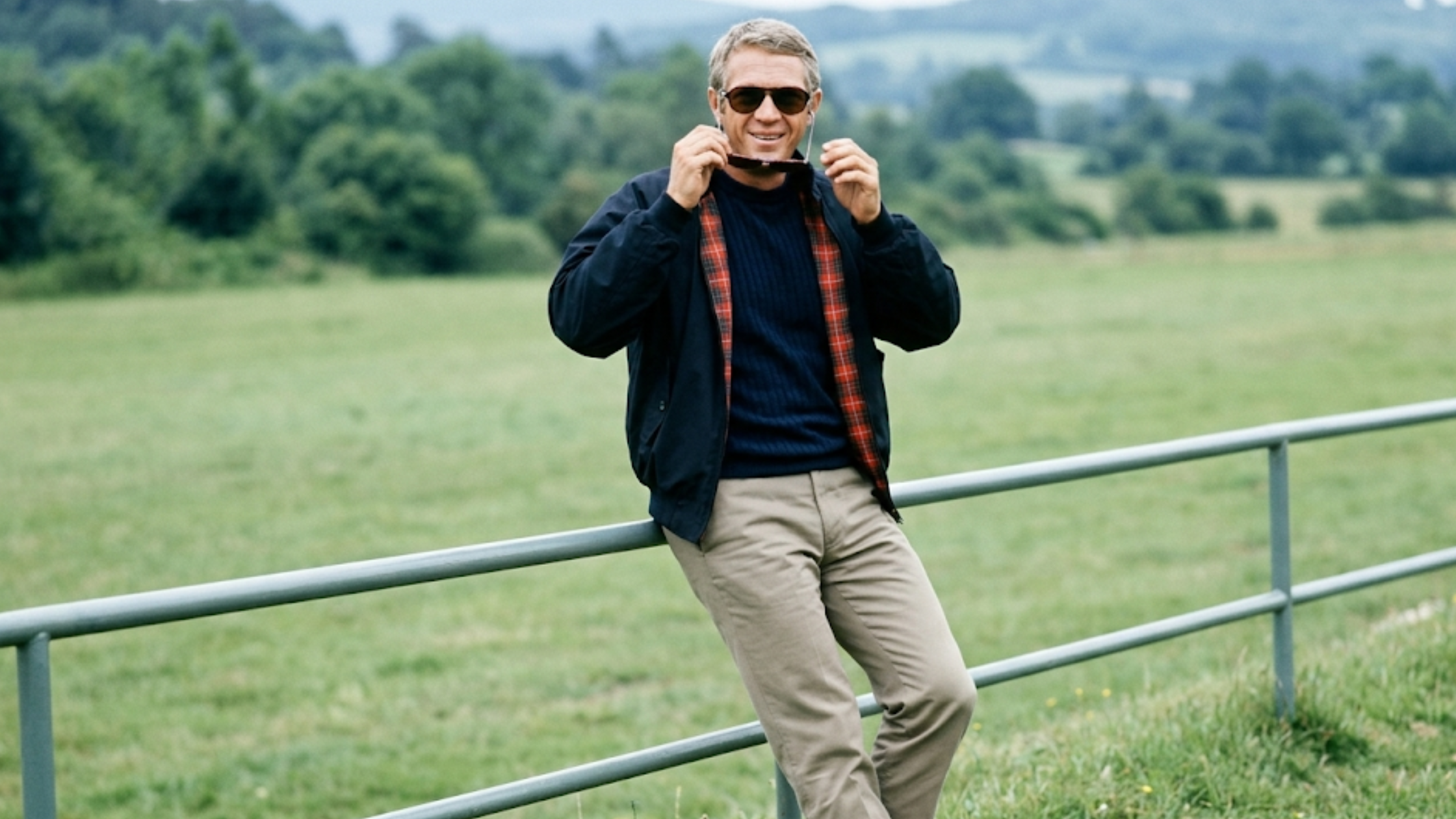 Steve McQueen navy blue Harrington jacket with double-button collar, raglan sleeves, zipper front, and tartan plaid lining