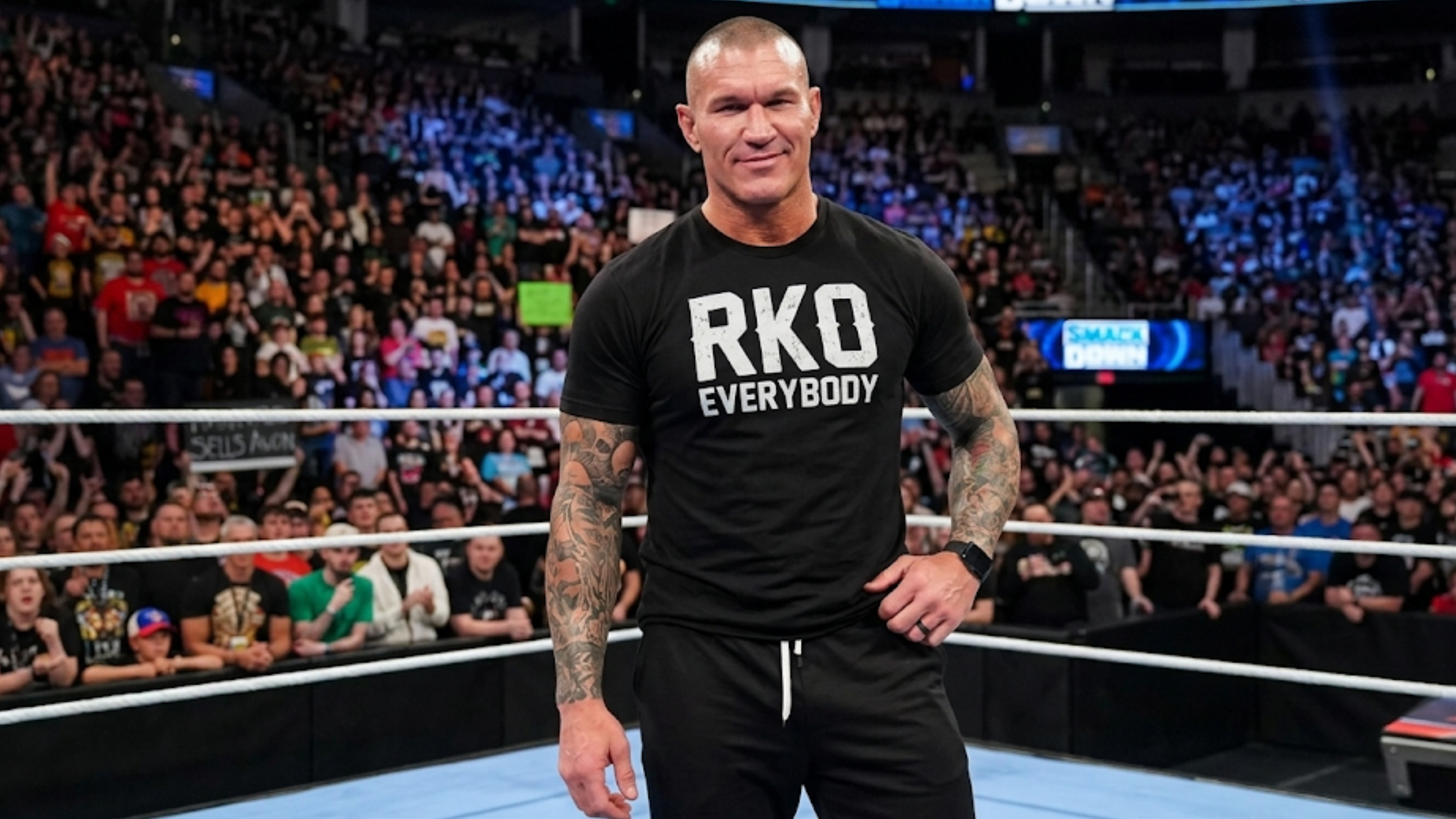 Randy Orton RKO Everybody black graphic T-shirt featuring distressed white lettering, crew neck design, and short sleeves