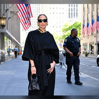 Jennifer Lopez CBS Studios Manhattan NYC 2026 black velvet trench coat with cape-inspired silhouette and gold neckline accent
