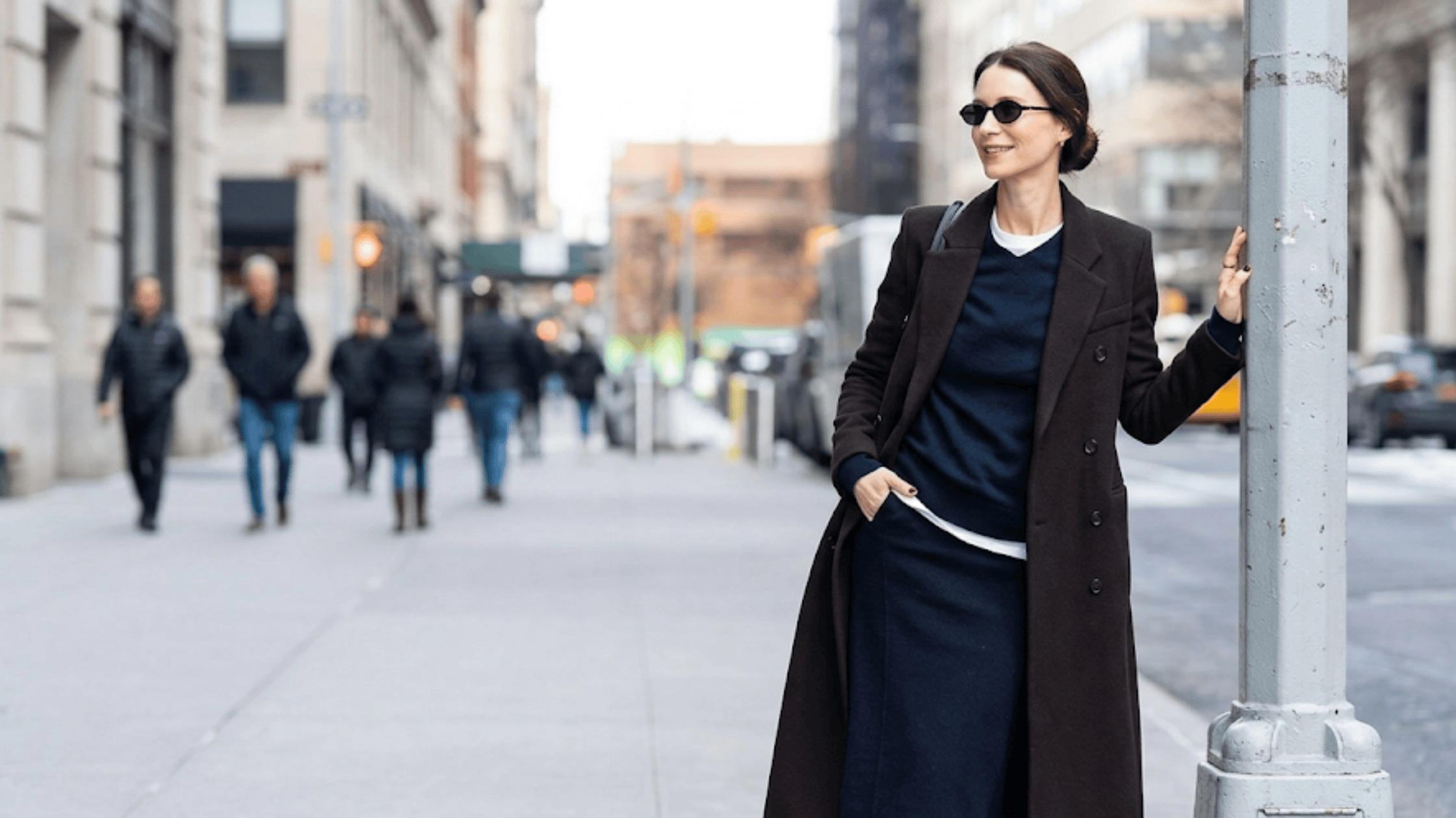 Caitriona Balfe street style dark espresso brown double-breasted wool maxi coat with classic notch lapels.