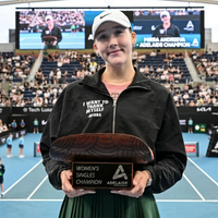 Mirra Andreeva 2026 Adelaide International black peplum track jacket with chest print, sporty luxury courtside fashion outfit
