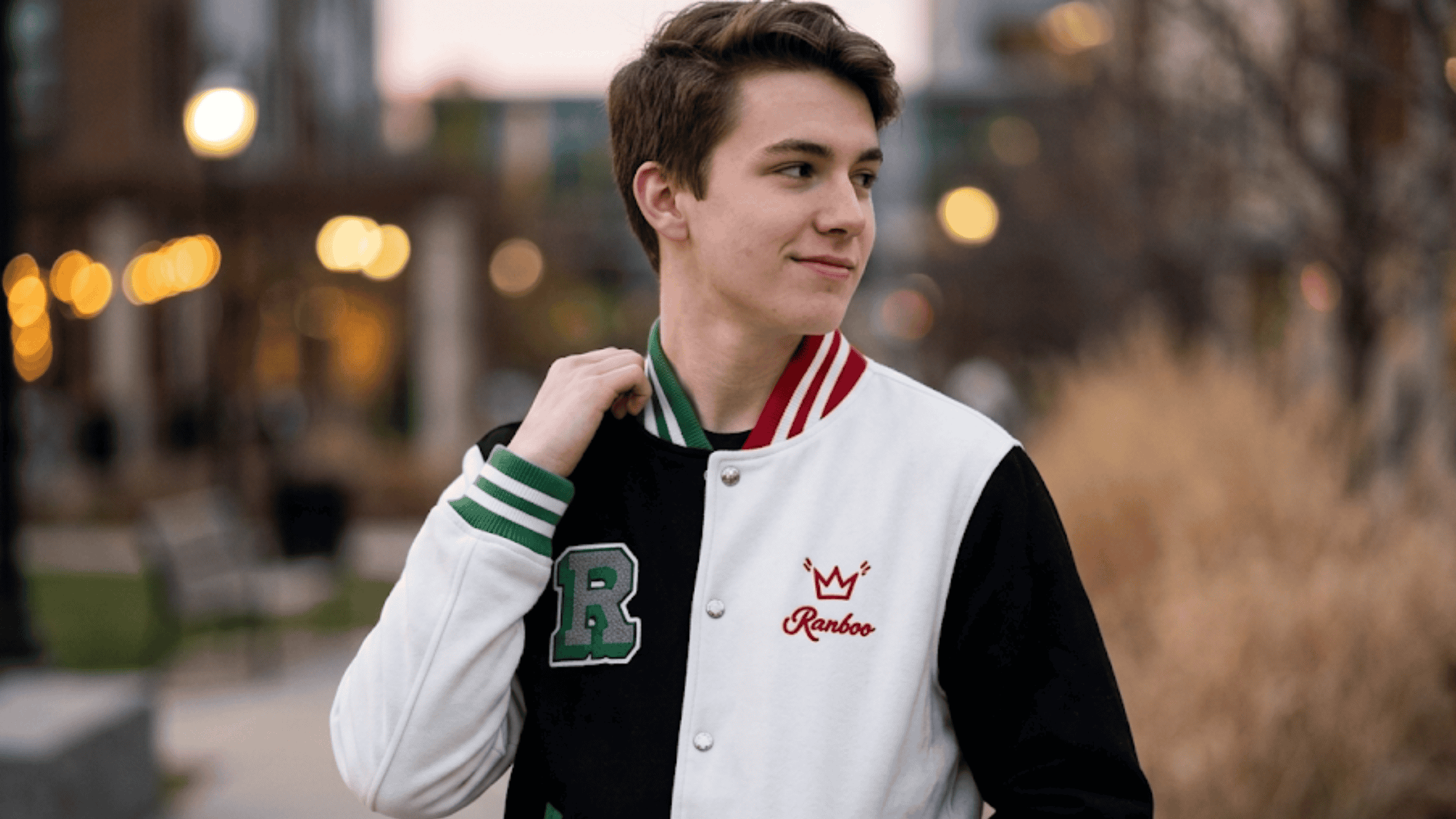 A high-contrast black and white Ranboo signature letterman jacket featuring premium wool construction, a rib-knitted collar, and the iconic "R" varsity logo embroidered on the chest.