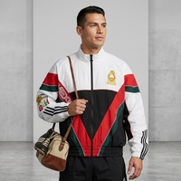 FIFA 2026 World Cup Mexico Adidas x Willy Chavarria colorblock track jacket in red, white, black with gold crest and streetwear styling
